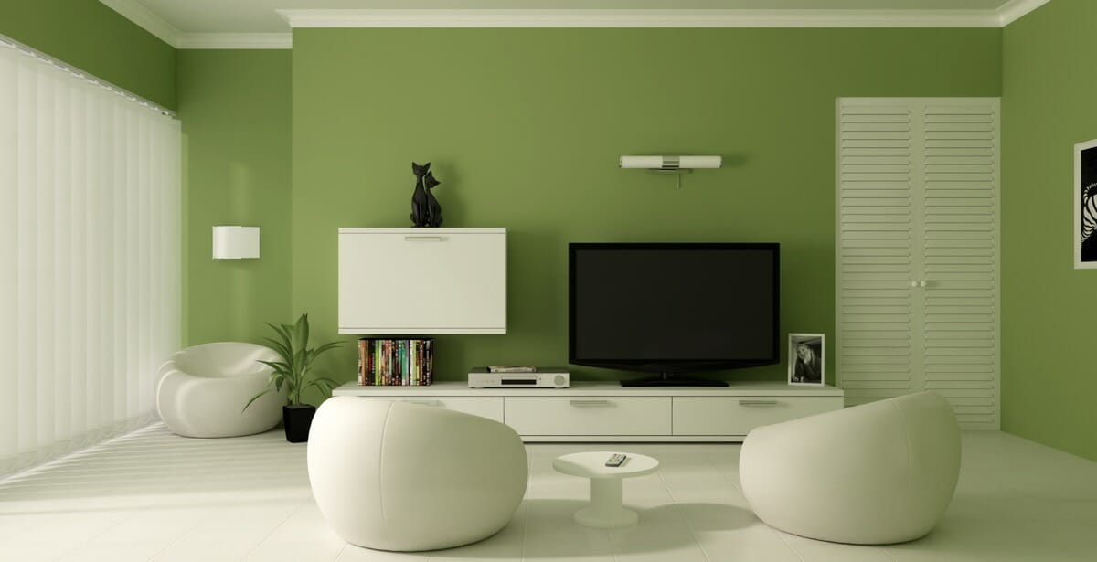 Hình ảnh mẫu phòng khách màu xanh lá đẹp mắt với tường màu xanh lá, tủ kệ tivi màu trắng, rèm cửa mỏng mảnh