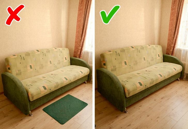 Hình ảnh cận cảnh ghế sofa dài, phía trước đặt thảm nhỏ màu xanh lá