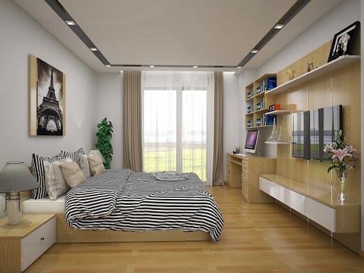Hình ảnh phòng ngủ rộng rãi với giường thấp, sàn gỗ, tranh tháp effiel treo đầu giường, cửa kính, rèm hai lớp, bàn học, tủ sách