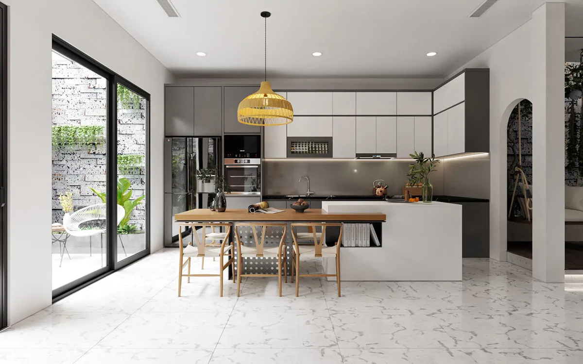 Bàn ăn gỗ tích hợp cạnh đảo bếp tiện lợi dưới ánh đèn thả trang trí